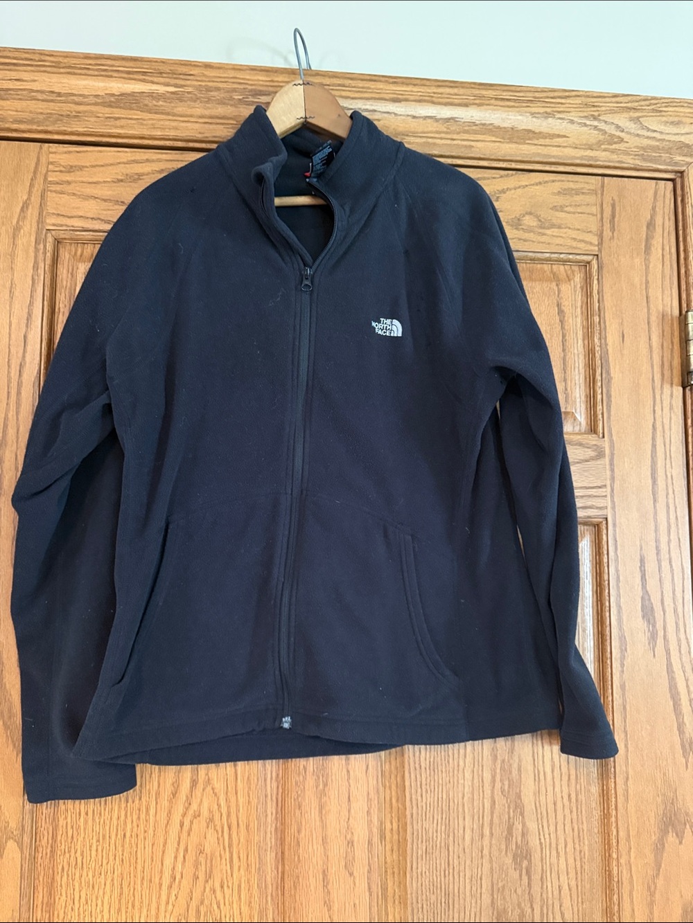 The North Face Black Fleece Zip up jacket with White Logo